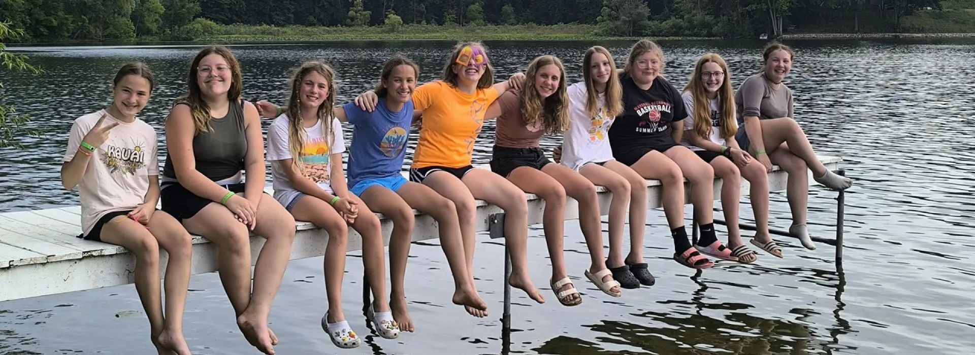 girls on camp dock